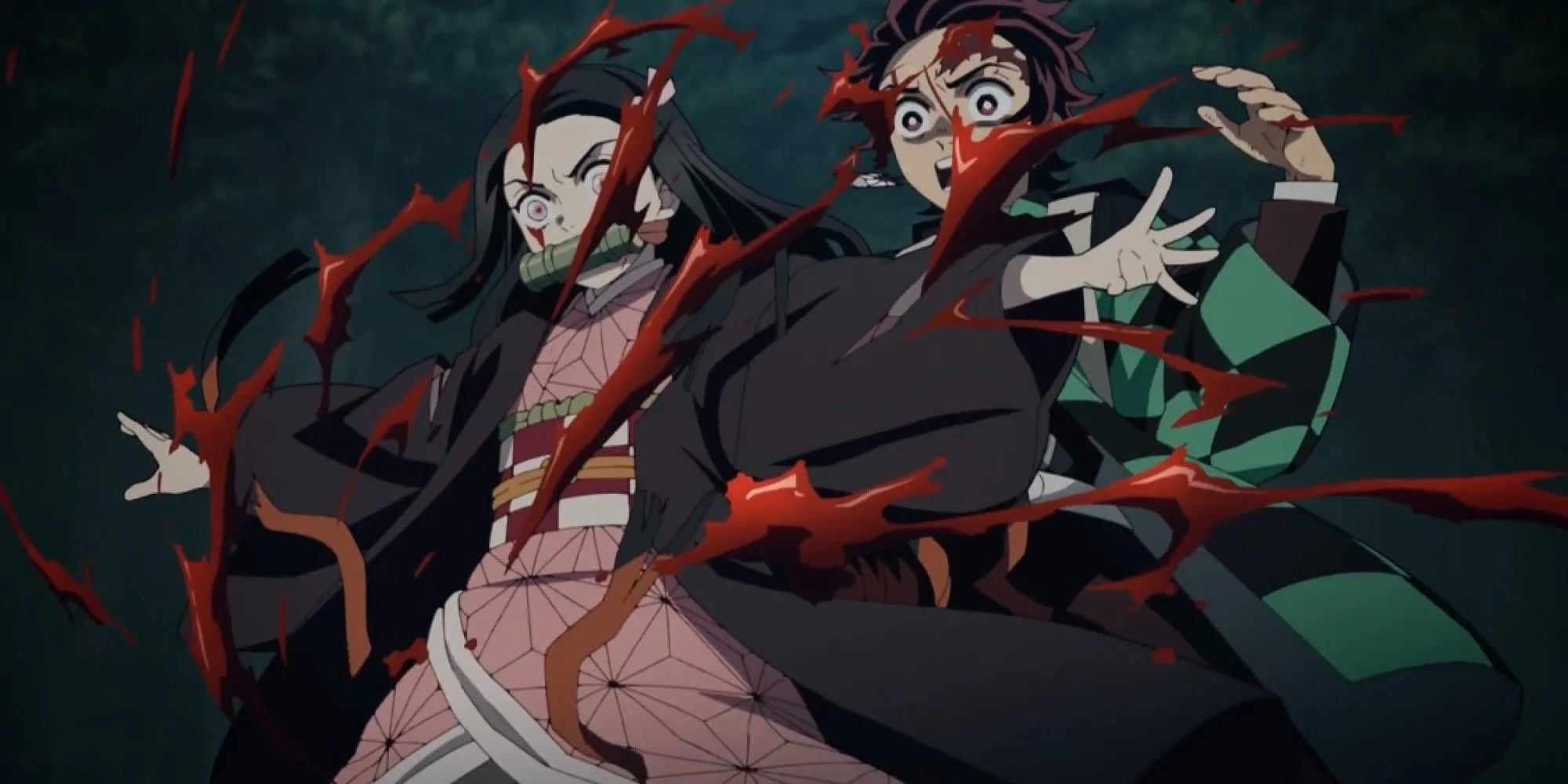 Anh em Tanjiro và Nezuko chiến đấu chống lại quỷ Hạ Huyền Rui trên núi Natagumo trong Demon Slayer.