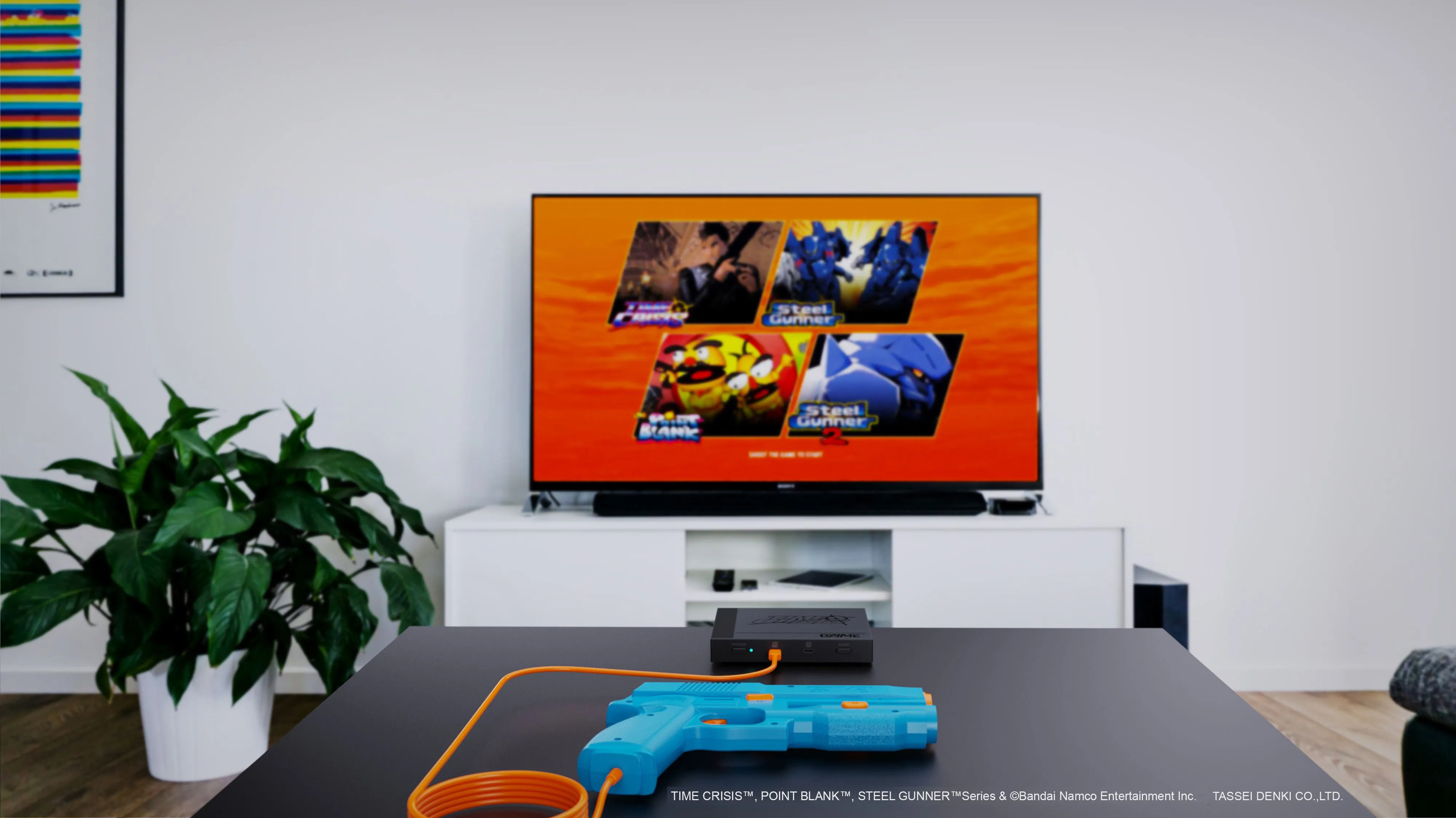 Hệ thống súng light gun G'aim'e Plug & Play đang hoạt động trước màn hình TV.
